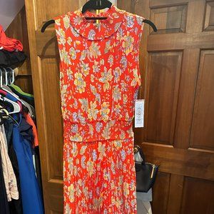 Red, Floral Sleeveless dress with mock collar and button back.  Pleated Skirt.